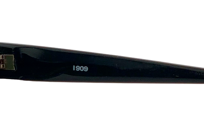 BLACK/GOLD CAT EYE FRAME WITH GREEN LENSES